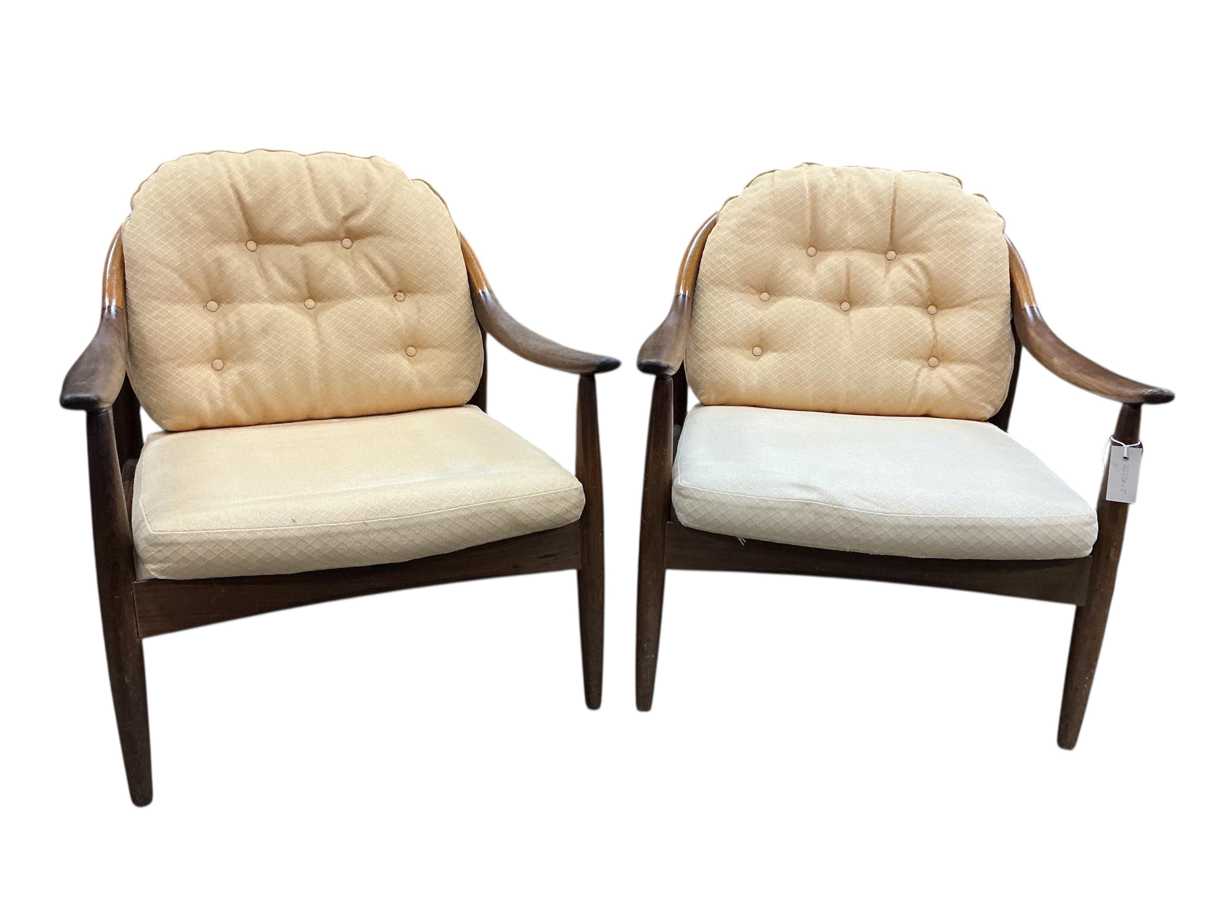 Greaves and Thomas: A pair of mid century teak armchairs, width 62cm, depth 70cm, height 70cm